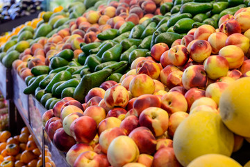 Close up Fresh fruit and vegetables at the counter of the vegetable shop, farmer marketplace. Organic, healthy, vegetarian diet food concept. Selective focus