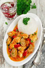 Chicken stew with mushrooms served  with rice