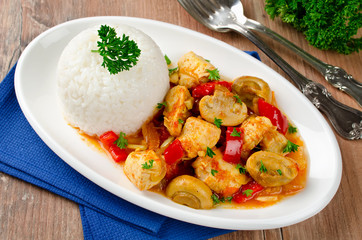 Chicken stew with mushrooms served  with rice