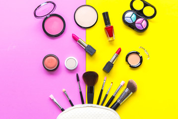 Set cosmetics makeup, brush, eye shadow and lipstick, colourful background.  Lifestyle Concept.