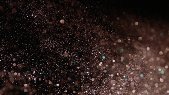 Realistic Glitter Exploding on Black Background. These clips are perfect for visual effects, compositing, and motion graphics. Use blending mode (screen).