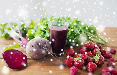 glass of beetroot juice, berries and vegetables