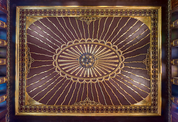 Wooden golden ornate ceiling with design based on sun rays inspired by the old flag of the ottoman empire at the public mosque of The Manial Palace of Prince Mohammed Ali Tewfik, Cairo, Egypt