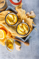 Cups of ginger tea with honey and lemon