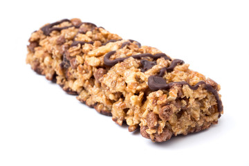 Chocolate cereal bars with wheat whole grain and chocolate on a white background.