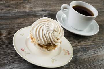 Meringue cookies cake and cup of hot tea