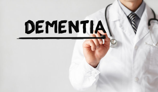 Doctor writing word DEMENTIA with marker, Medical concept
