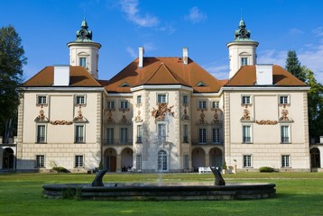 Decorative facade of Baroque style Bielinski Palace in Otwock Wielki (near Warsaw) seen from a park, Poland - obrazy, fototapety, plakaty