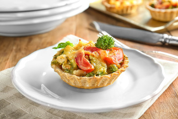 Delicious crispy tart with broccoli on plate