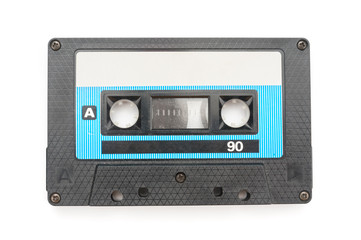 Old audio tape cassette on white background