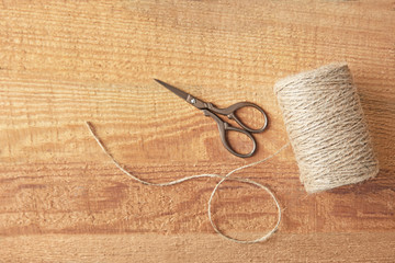 Hank of hemp twine on wooden background