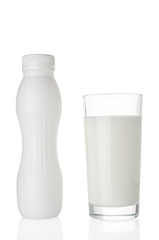 Milk glass and bottle isolated on white background