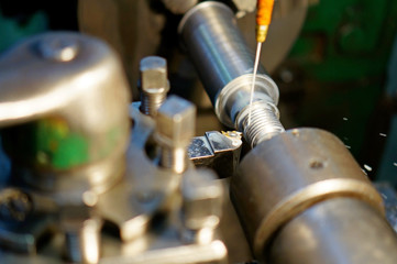 Technicians are turning lathe with horizontal lathe machine.