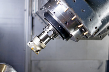 The CNC lathe machine or Turning machine drilling the metal rod with the drill tool and center drill tool .The hi-technology machining concept.