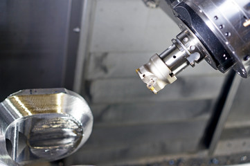 The CNC lathe machine or Turning machine drilling the metal rod with the drill tool and center drill tool .The hi-technology machining concept.