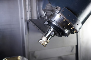 The CNC lathe machine or Turning machine drilling the metal rod with the drill tool and center drill tool .The hi-technology machining concept.