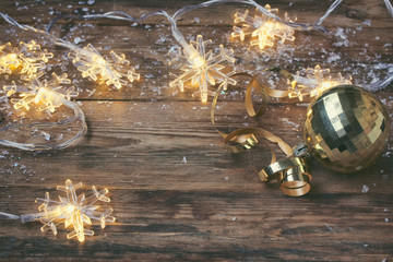 christmas, new year greeting card, garland light snowflake border and golden ball