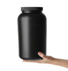 Woman holding jar with protein powder on white background