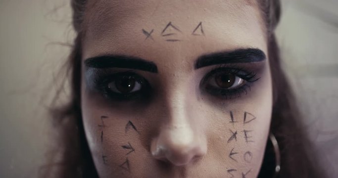 The lady with make have the genre of Egyptian mummy. Concept halloween. Slow Motion.The penetrating look
