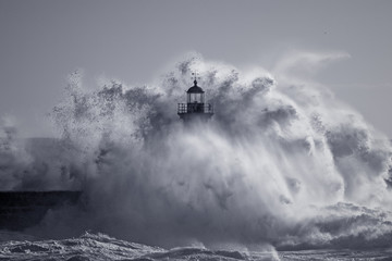 Od lighthouse embraced by stormy waves - Powered by Adobe