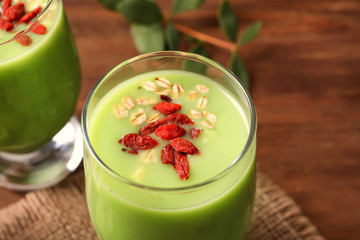 Smoothie with goji berries in glass, closeup
