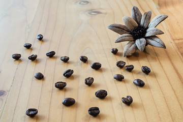 Obraz na płótnie Canvas close up of Coffee beans on wood background, selective focus (detailed close-up shot)