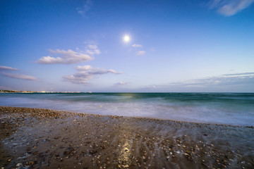sunset over a beach on a warm day