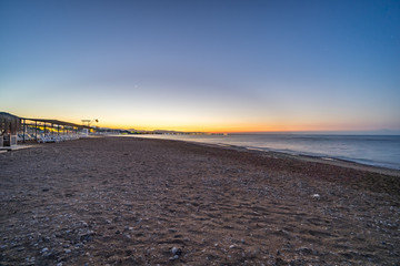 sunset over a beach on a warm day