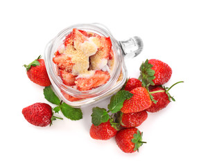 Tasty strawberry dessert in mason jar, isolated on white