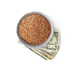 Raw buckwheat and money on white background. Price growth concept