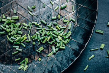 Chopped Chives in a Wrought-Iron Skillet