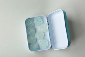 Open box with hard mint candies on light background