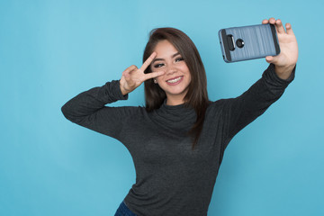 Hispanic Girl Taking Selfie