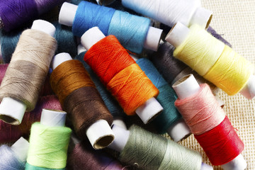Spools of different sewing threads.