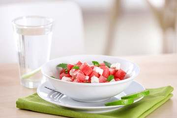 Fresh salad with watermelon on table