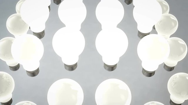 A hi-tech 3d rendering of raising light bulbs. They do it together . At first the central bulbs move up. Then the middle move up and the fringe ones. It looks like a conveyer functioning