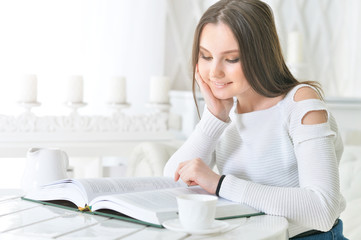 Young attractive woman with book