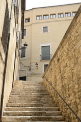 Fototapeta na wymiar Stairs in alley in Girona, Spain