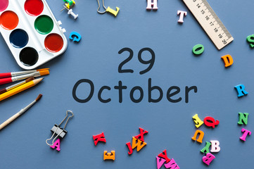 October 29th. Day 29 of october month, calendar on teacher or student table, blue background . Autumn time