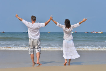 couple  with raised hands
