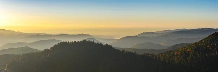 Küchenrückwand glas motiv Herbstlandschaft - Schwarzwald. Panoramablick über den herbstlichen Schwarzwald, das Rheintal und die Vogesen (Frankreich) in der Ferne bei Sonnenuntergang. © PhotoGranary