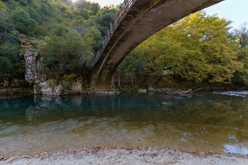 Fototapeta na wymiar Scenic Papigo bridge over Voidomatis river in Zagoria, Epirus, Greece