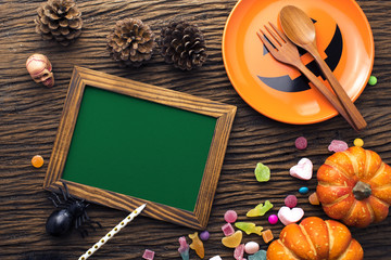 wood frame banner with halloween dinner decoration on wood ground