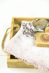 wooden tray with accessories for spa procedures with a floppy, candles and soap
