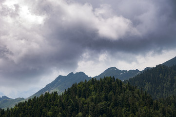 The tops of the mountains in the clouds