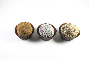 Different truffles over white background