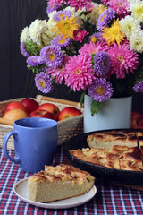 Decorated table with autumn bouquet  and pie