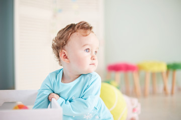 Little baby playing with color toys. little child is playing with toys in the studio