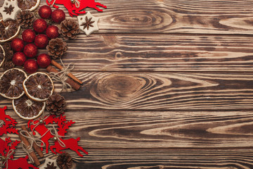 Wooden christmas background with handmade christmas tree toys