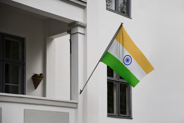 India flag.  Indian flag displaying on a pole in front of the house. National flag of  India waving on a home hanging from a pole on a front door of a building. - 177981341